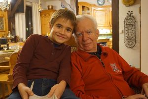 grandpa-and-grandson-smiling-at-camera